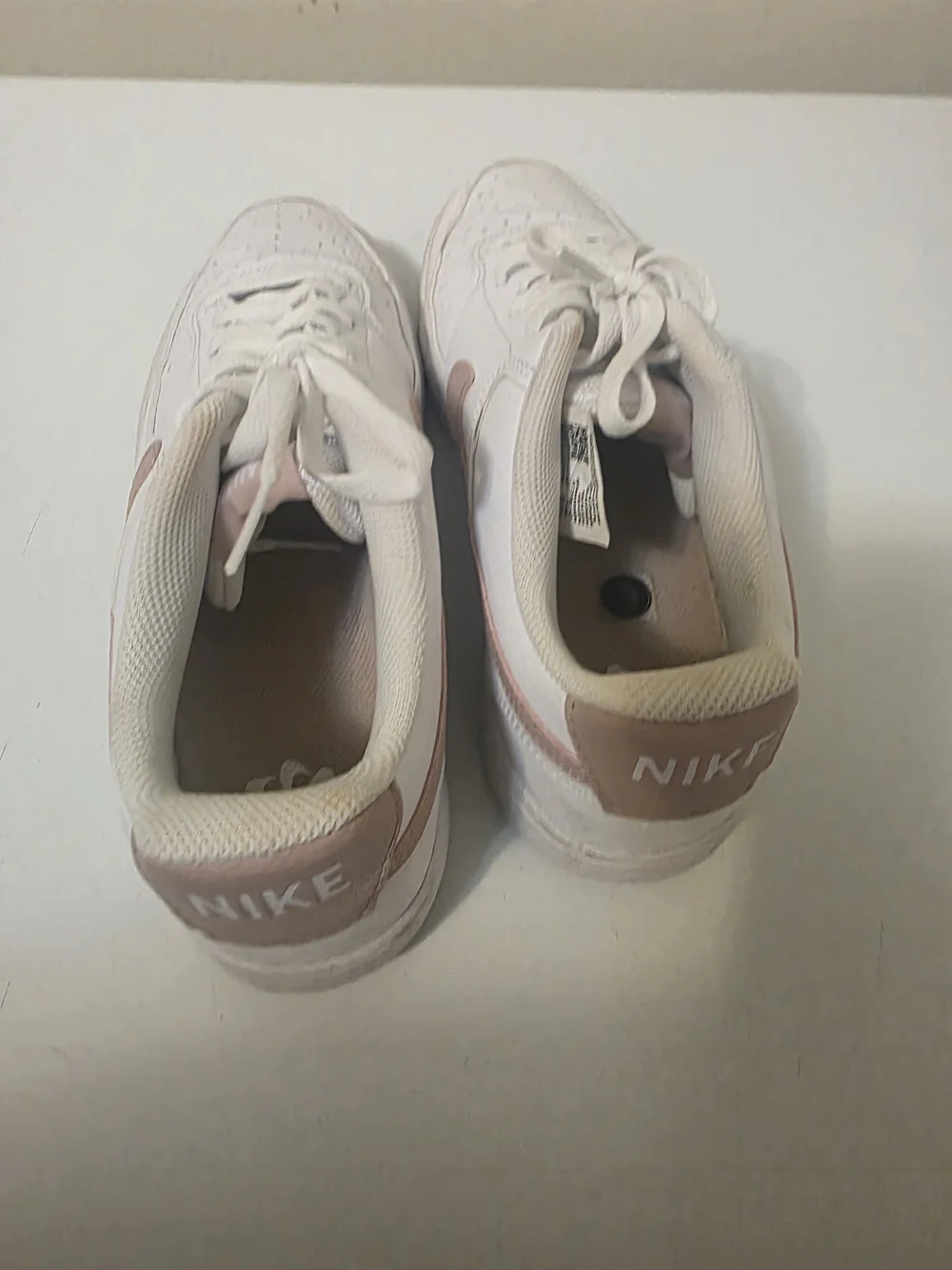Nike Women's White Sneakers with Blush Swoosh